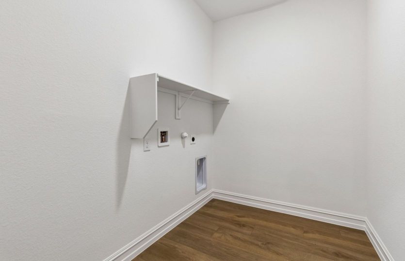 Laundry room with built-in shelving