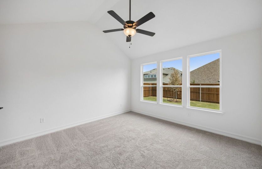 Primary bedroom with large windows