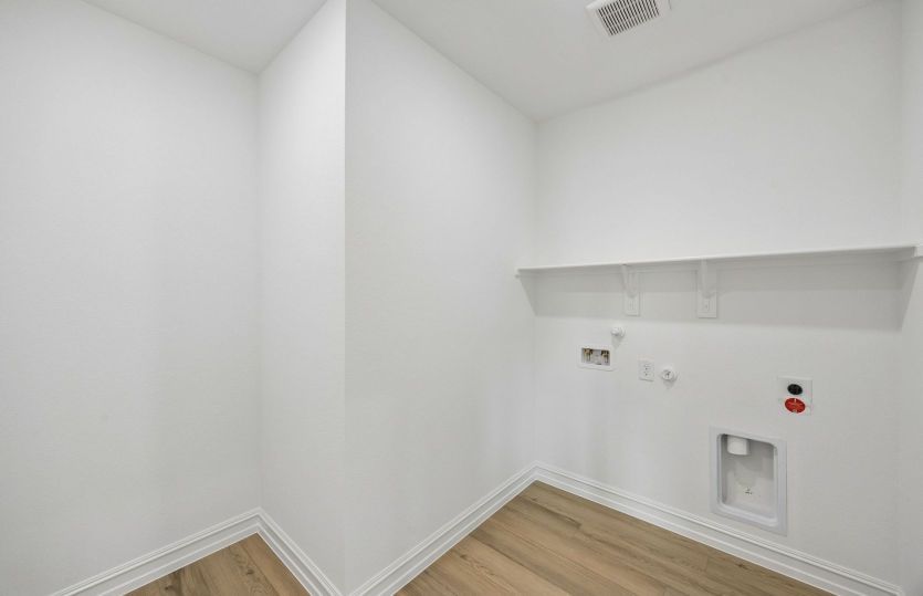 Laundry room with built-in shelving