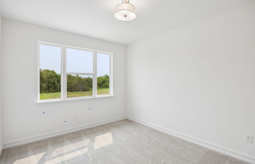 Secondary bedroom with large windows