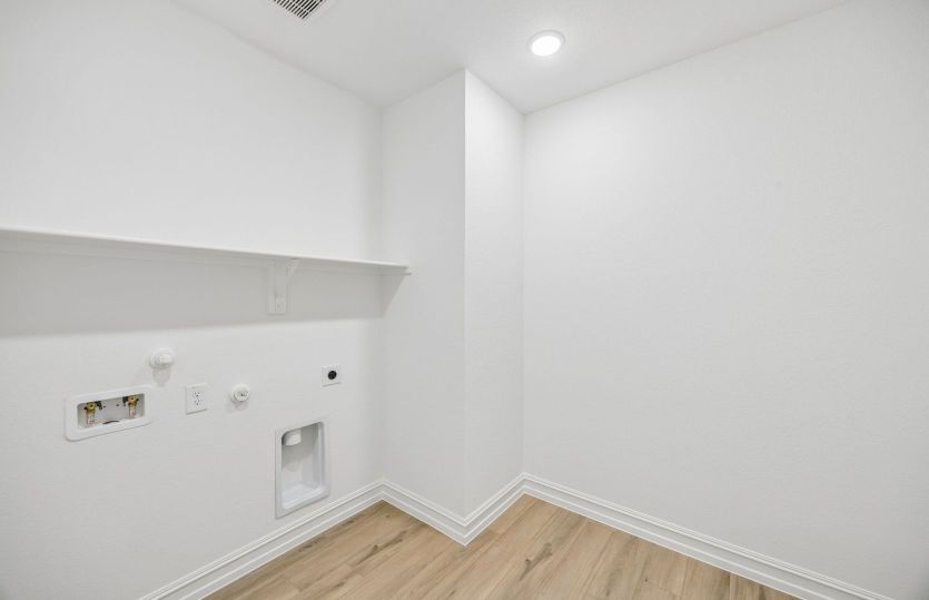 Laundry room with built-in shelving