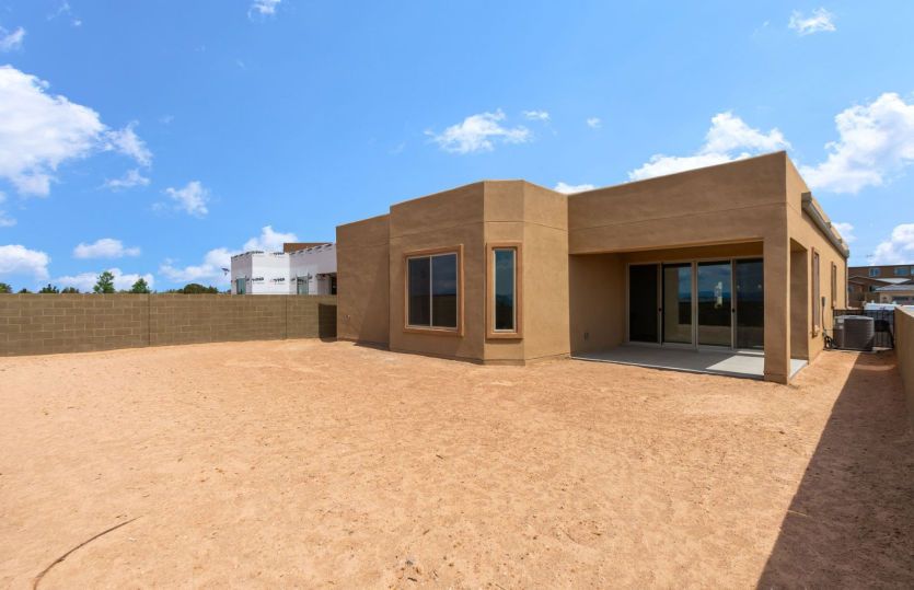 Spacious backyard with covered back patio
