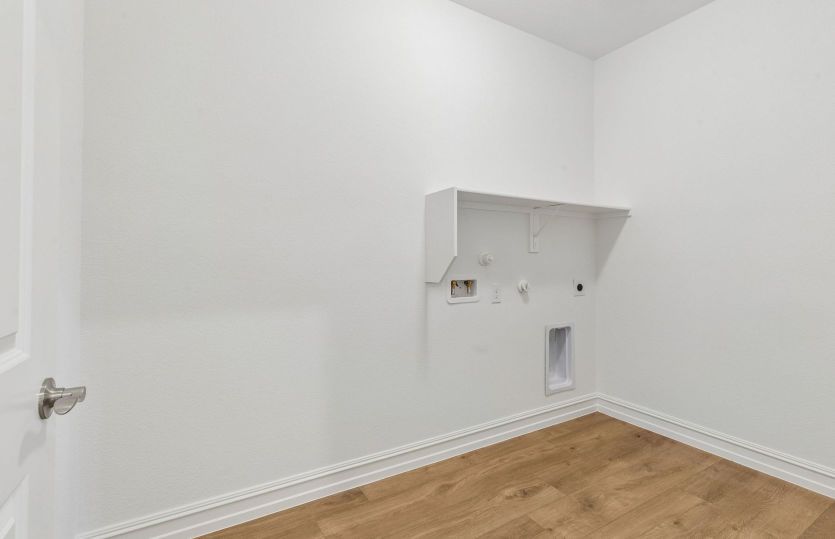 Laundry room with built-in shelving