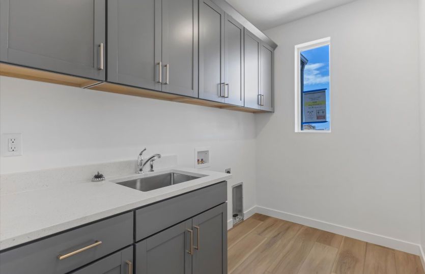 Laundry with Cabinets & Sink