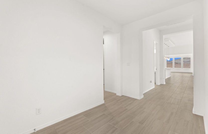 Spacious entry way with access to secondary bedrooms and den