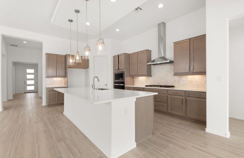 Chef's kitchen layout with oversized island