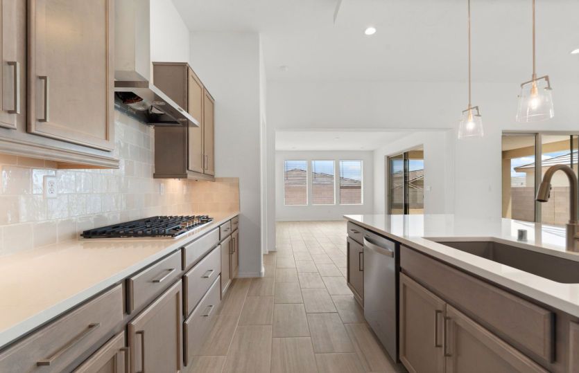 Kitchen featuring pendant lighting and abundant cabinet space