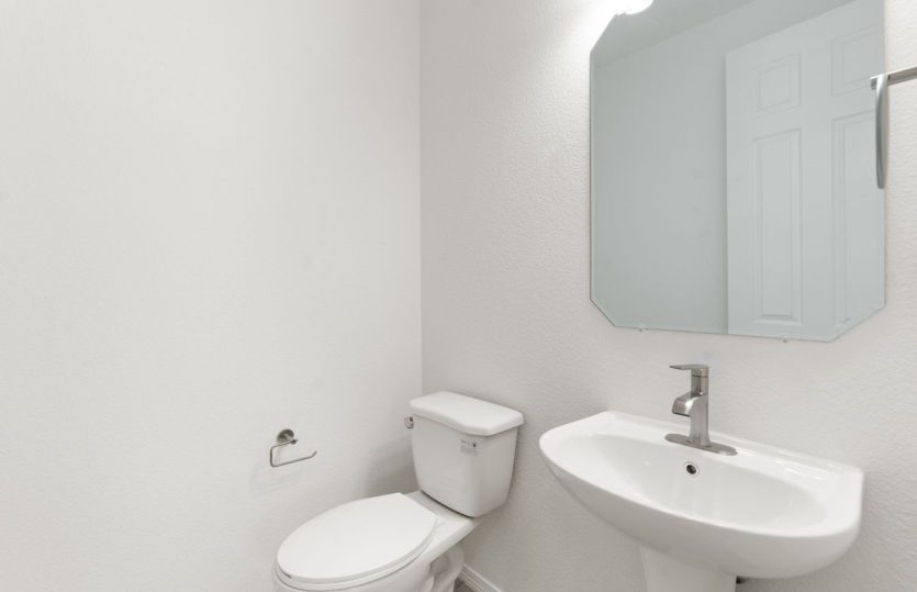 Powder bath right off of gathering room is convenient for guests