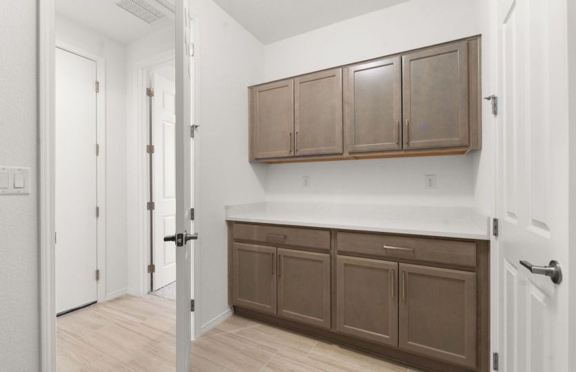 Added laundry room cabinets for organization and storage