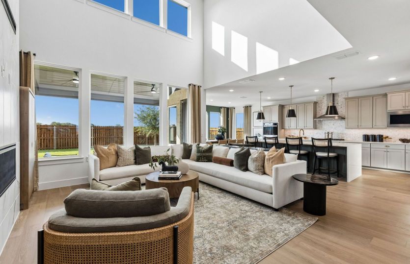Two story windows and natural light in gathering room*model representation