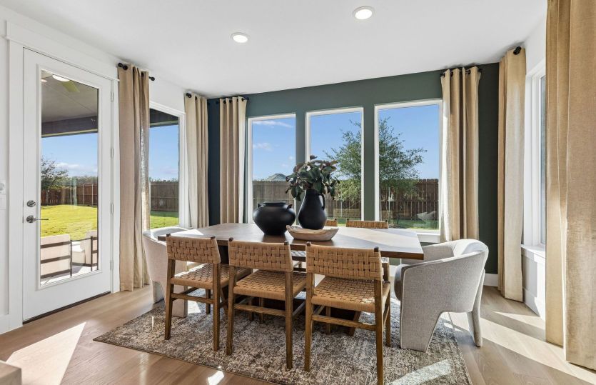 Cafe area with large windows and backyard access*model representation