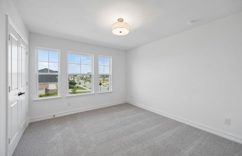 Secondary bedroom with large windows