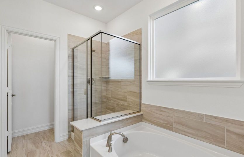 Separate tub and shower in owners bath