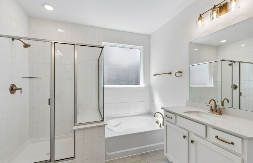 Separate tub and shower in primary suite