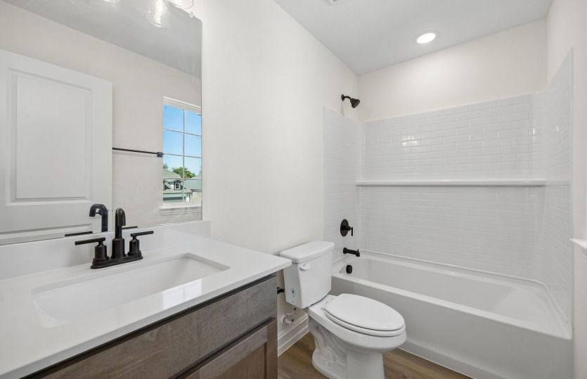 Secondary bath with tile surrounded shower