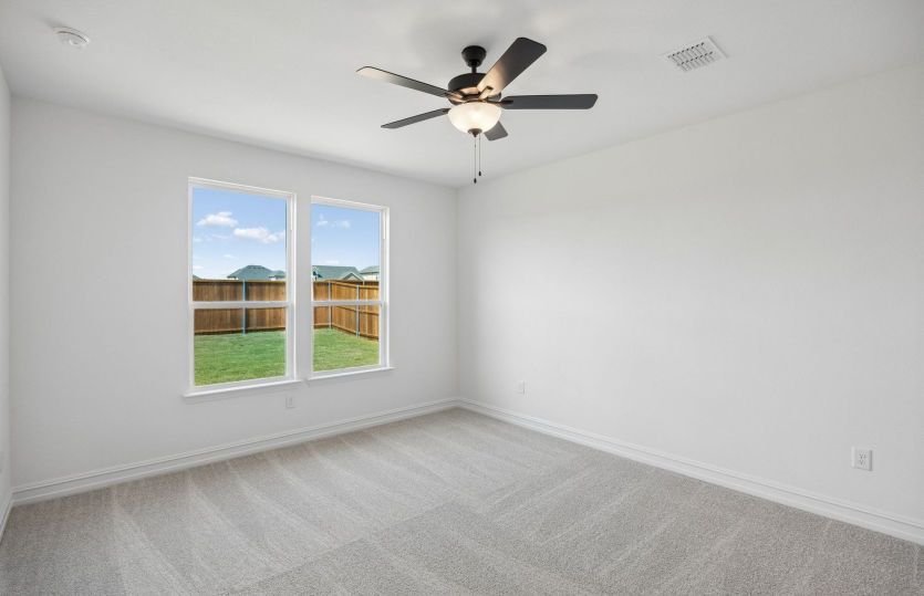 Primary bedroom with large window