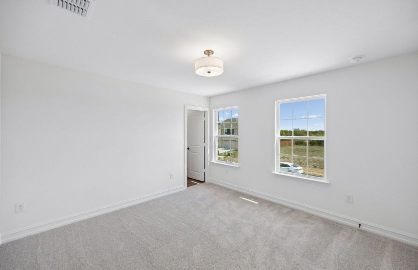 Secondary bedroom with large windows