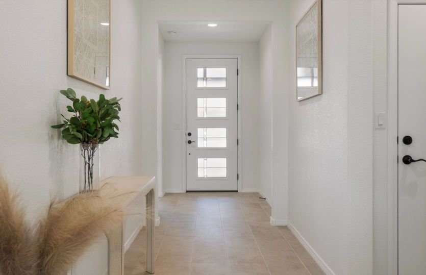Welcoming entryway with secondary bedrooms to the right