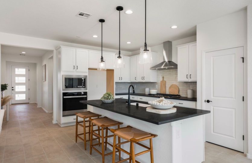 Modern kitchen with upgraded chef's kitchen package and ample cabinet space