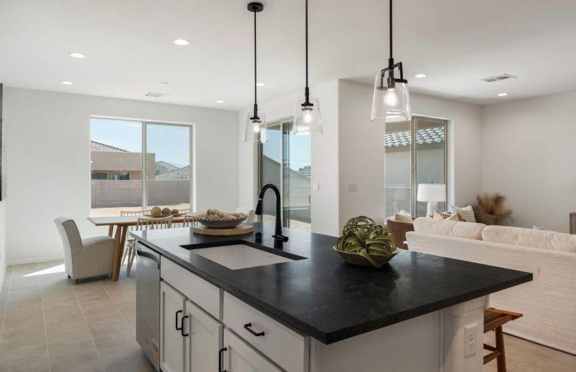 Kitchen flows seamlessly into living and dining areas