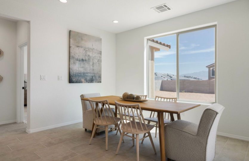 Large window naturally lights dining area