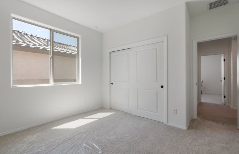Third bedroom with natural light and generous closet space