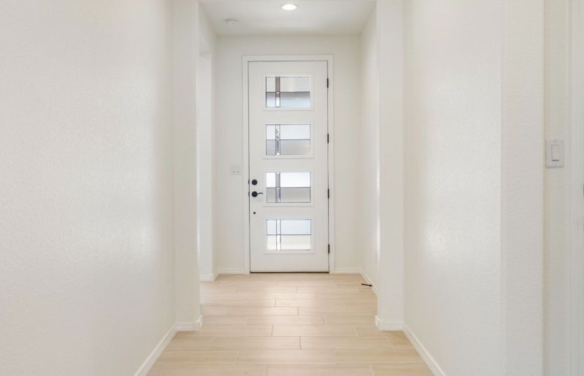 Welcoming entryway with secondary bedrooms to the right