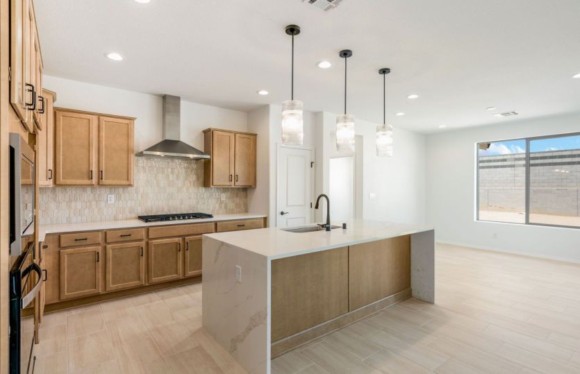 Luxurious waterfall edge on the oversized kitchen island