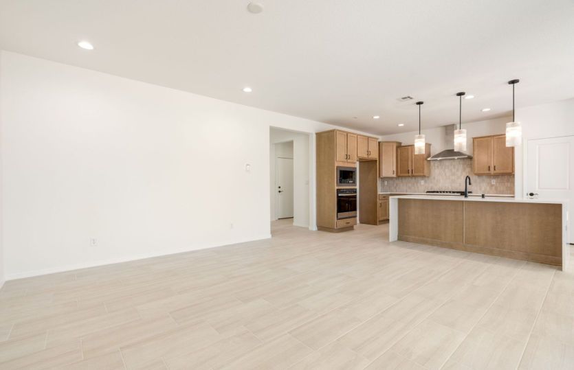 Kitchen opens into large living area perfect for family time