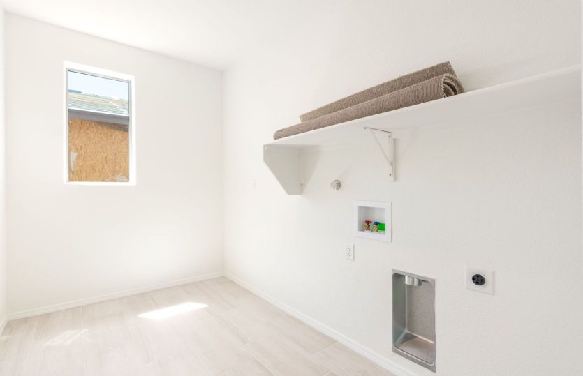 Functional laundry room with build in shelving