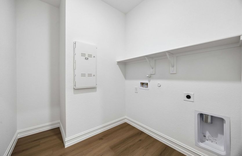 Laundry room with built-in shelving