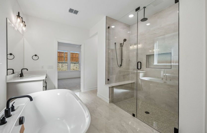Double vanity and beautiful shower in primary bath