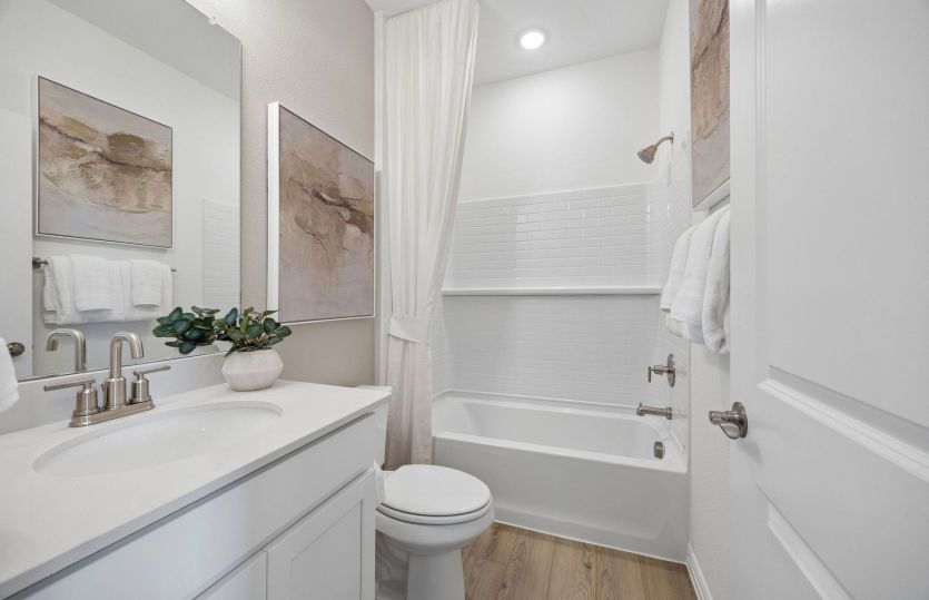 Secondary bath with tile surrounded shower