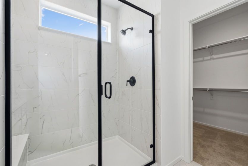 Owner's Suite Bathroom with Tiled Shower