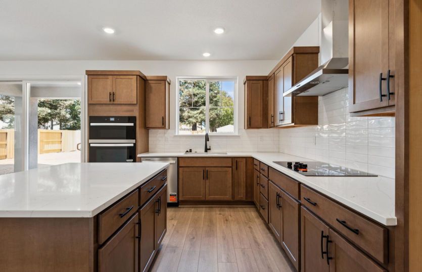 Kitchen with stacked tile backsplash