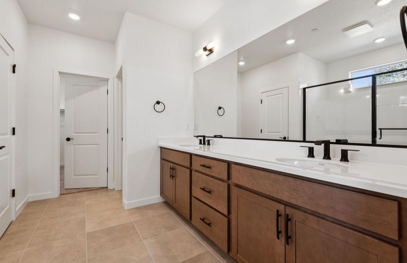Owner's bath with dual vanity