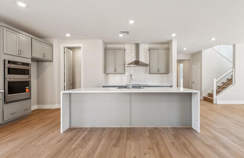 Kitchen with large waterfall edge island