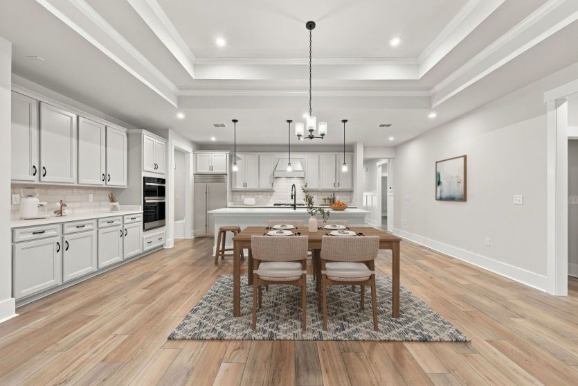 Elegant dining room in the Azle floorplan with easy access to the kitchen.