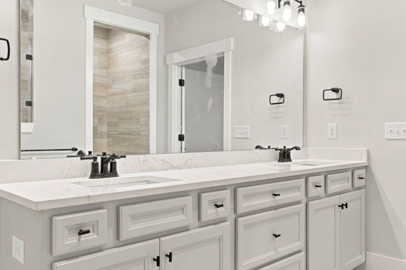Owner’s bath with thoughtful finishes and a relaxing atmosphere.