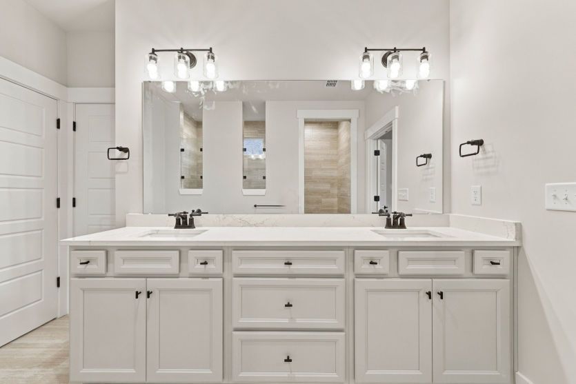 Owner’s bath with thoughtful finishes and a relaxing atmosphere.