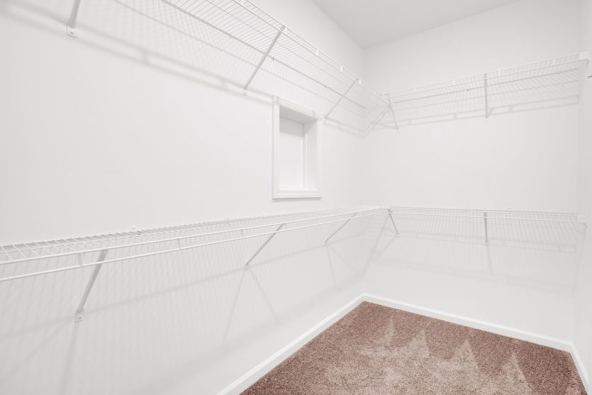 Owner's Suite Walk-in Closet w/ Laundry Chute