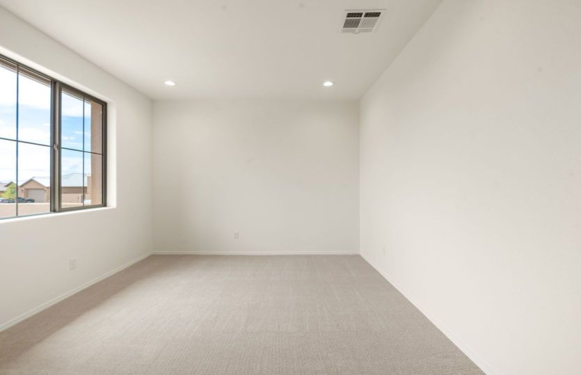 Large window naturally lights den making it perfect for productivity