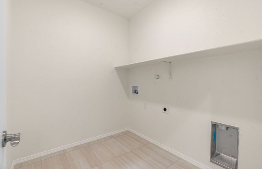 Laundry room with built-in shelf for added function
