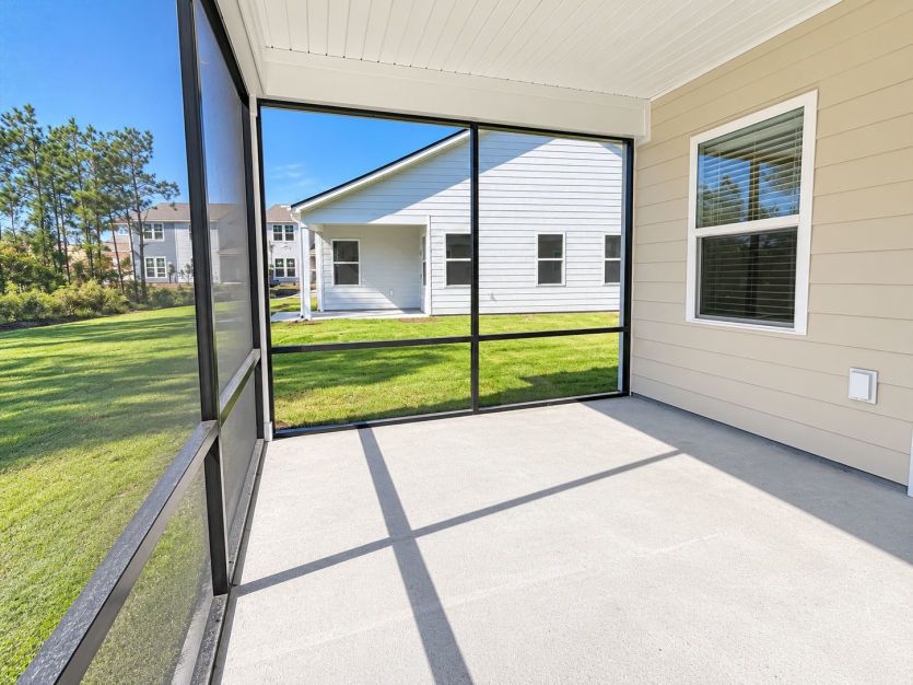 Screened lanai offering a relaxing outdoor retreat.