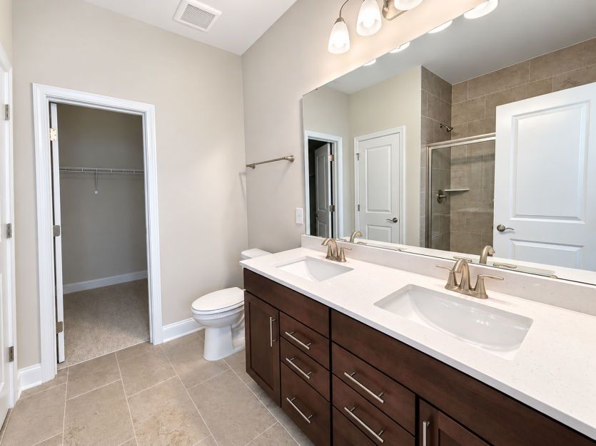 Beautiful owner’s bath with a sleek, modern design.