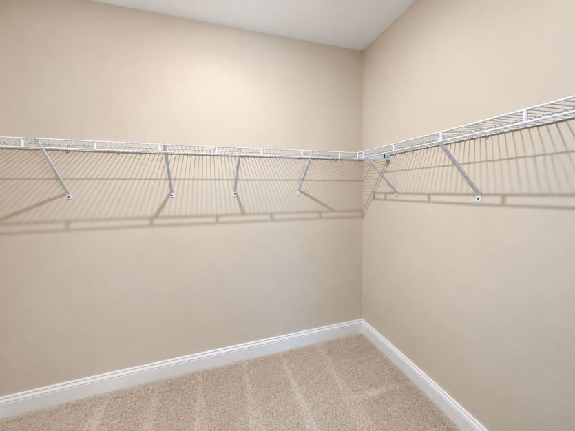 Walk-in closet with ample storage for everyday essentials.