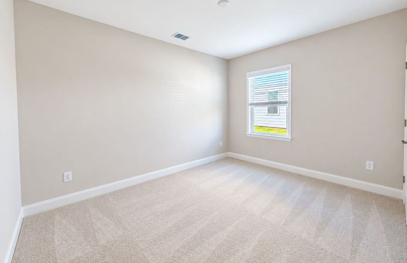 Versatile third bedroom ideal for a home office or flex space.