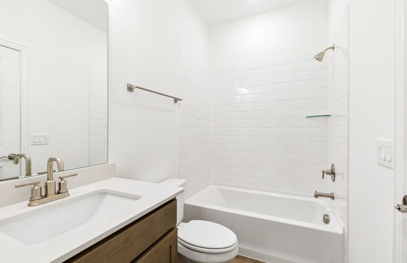 Secondary bath with tile surrounded shower