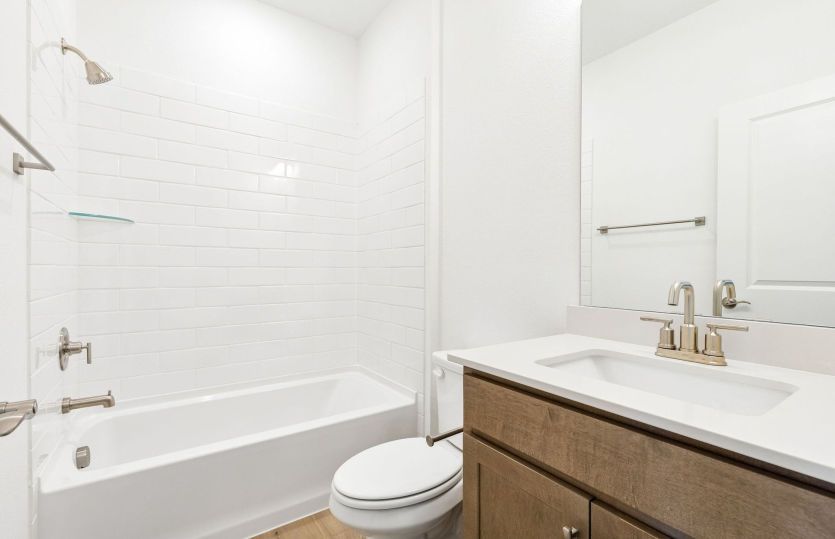 Secondary bath with tile surrounded shower