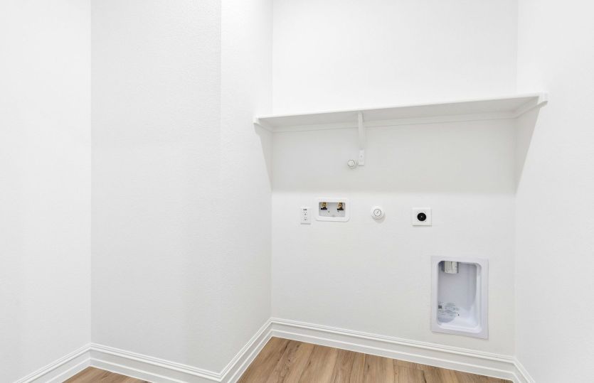 Laundry room with built-in shelving